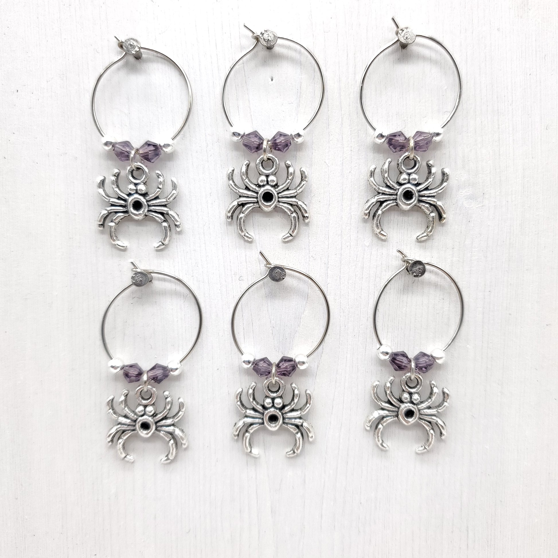Spider wine charms with crystal beads on white background