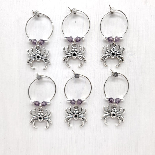 Spider wine charms with crystal beads on white background